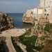 ...che permette laffaccio sullo scenario pi conosciuto e immortalato di Polignano: quello di Lama Monachile. Si tratta del letto di un antico torrente incastonato fra le pareti di roccia a strapiombo, la cui foce  rappresentata da una pittoresca spiaggia di sabbia e pietroline